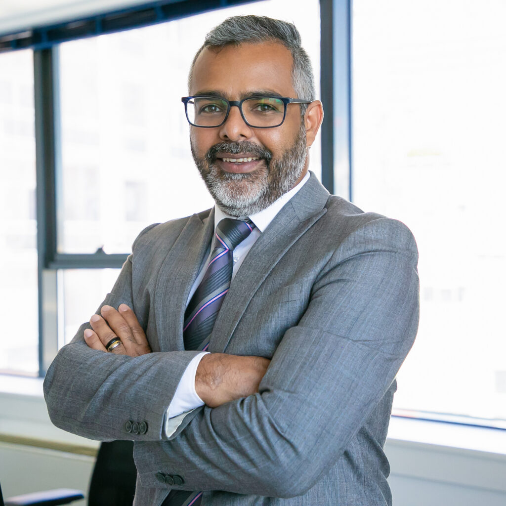 Experienced businessman standing in office room